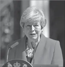  ?? Associated Press photo ?? Britain's Prime Minister Theresa May makes a statement outside at 10 Downing Street in London, Friday. Theresa May says she’ll quit as UK Conservati­ve leader on June 7, sparking a contest for Britain's next prime minister.