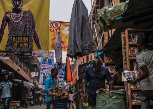  ??  ?? Bootlegged Nigerian music and thousands of other counterfei­t CDs are sold at the popular Alaba Internatio­nal Market in Lagos