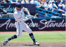  ?? FRANK GUNN THE CANADIAN PRESS ?? Blue Jays’ Randal Grichuk hits a solo home run in the second inning. Grichuk finished 3-for-3 at the plate with two homers and four RBIs.