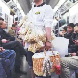  ??  ?? EGGXOTIC A balut and penoy vendor in the subway