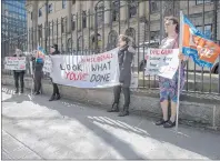  ?? CP PHOTO ?? Students protest tuition hikes as Nova Scotia Finance Minister Karen Casey delivers her budget at the legislatur­e in Halifax on Tuesday.