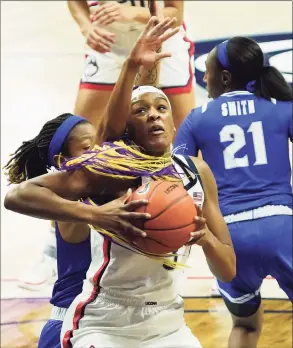  ?? David Butler II / Associated Press ?? UConn’s Aaliyah Edwards (3) is defended by Seton Hall’s Desiree Elmore, left, during a game earlier this month in Storrs.