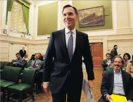  ?? ADRIAN WYLD/THE CANADIAN PRESS ?? Finance Minister Bill Morneau is facing heightened concerns about Canadian competitiv­eness after a report from the Senate banking committee called for an urgent revamp of Canada’s tax and regulatory system.