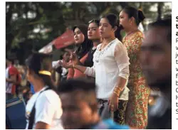  ?? — AFP ?? Something to cheer about: Rohingya women joining in the thrill as they watched the final match between the Cheras Harimau team and Selangor.