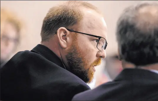  ?? Stephen B. Morton The Associated Press ?? Travis Mcmichael speaks to his attorney Robert Rubin on Tuesday during his trial in the slaying of 25-year-old Ahmaud Arbery.