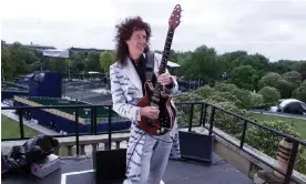  ?? Photograph: Sean Dempsey/ PA ?? ‘It was hard to function – I had so much fear’: Brian May rehearsing on the roof of Buckingham Palace ahead of the golden jubilee celebratio­ns in 2002.