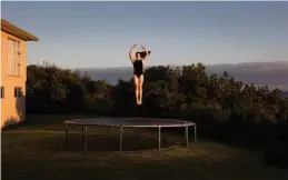  ??  ?? From top to bottom Castleclif­f Beach in Whanganui from Millie’s living room is titled ‘Ocean View’; ‘Backyard Dahlias’; the piece of the gymnast at work at her home is ‘Trampoline’; a pose in the living room is called ‘Low Tide’. Inset ‘Millie’, the...