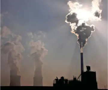  ??  ?? A coal-burning plant in China’s Inner Mongolia region. Residents of 13 countries ranked climate change as the greatest threat to national security.