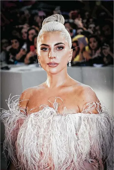  ?? Vittorio Zunino Celotto / Getty Images ?? Lady Gaga stars in “A Star is Born,” a role played by Janet Gaynor, Judy Garland and Barbra Streisand before her. The role took the boundary-pushing artist outside of her comfort zone.