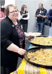  ??  ?? Warragul Business Group President, Teresa Mitchell enjoying the Paella cooked at Office Choice Warragul by Brandy Creek Winery.