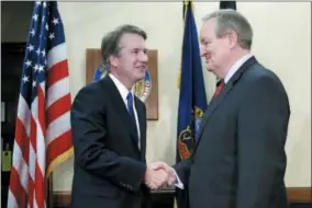  ?? AP PHOTO/ALEX BRANDON ?? Supreme Court nominee Brett Kavanaugh, left, shakes hands with Sen. Mike Crapo, R-Idaho, before the start of their meeting, on Capitol Hill, Wednesday, July 11, 2018in Washington.