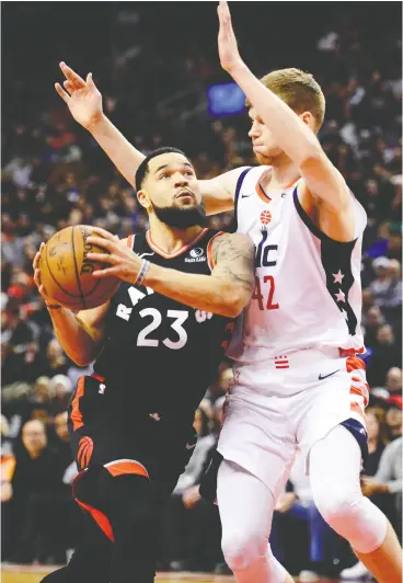  ?? Frank Gunn / the cana dian press ?? Raptors guard Fred Vanvleet drives to the net against Washington Wizards forward Davis Bertans in Friday night’s game in Toronto.