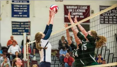  ?? RICK KAUFFMAN — 21ST CENTURY MEDIA ?? Bishop Shanahan’s Rita Shultz, left, and Katie Quinlan go up to block Upper Merion’s Nikki Carpenter during the District 1 Class AAA volleyball final at Abington High on Saturday.