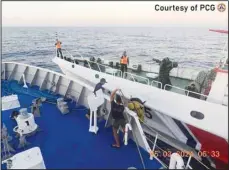  ?? ?? In this handout photo provided by the Philippine Coast Guard, a Chinese coast guard ship approaches a Philippine coast guard ship, (foreground), causing a minor collision, in the vicinity of Second Thomas Shoal on March 5. The vessels collided in the disputed South China Sea, slightly injuring four Filipino crewmen in a new confrontat­ion that unfolded as Southeast Asian leaders gathered for an Asian summit where alarm over Beijing’s aggression at sea was expected to be raised. (AP)