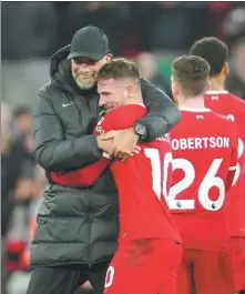  ?? AP ?? Jurgen Klopp (left) hugs Mac Allister after Liverpool beat Chelsea in an English Premier League match at Anfield on Wednesday.