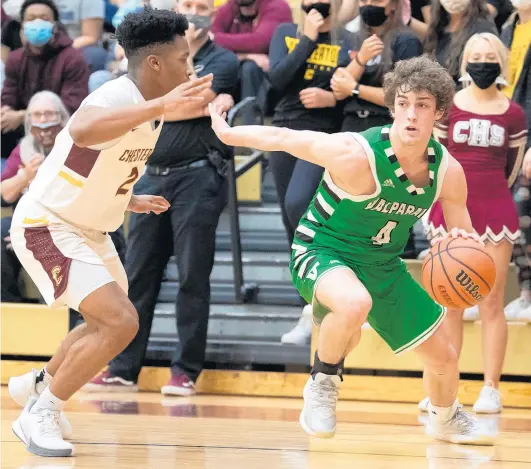  ?? KYLE TELECHAN/POST-TRIBUNE ?? Valparaiso’s Breece Walls, right, tries to get around Chesterton’s Travis Grayson during a first-round game in a 2021 Class 4A Sectional.