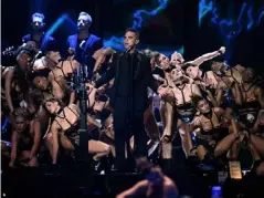 ??  ?? Robbie Williams performs at the Brits in 2017 – the year won the Outstandin­g Contributi­on to Music (Getty)