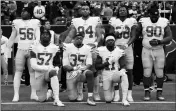  ?? ASSOCIATED PRESS ?? IN THIS DEC. 10 FILE PHOTO, San Francisco 49ers San Francisco 49ers’ Eli Harold (57), Eric Reid (35) and Marquise Goodwin (11) kneel during the national anthem before an NFL game against the Houston Texans in Houston. President Donald Trump’s feud with...