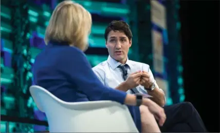  ?? SEAN KILPATRICK, THE CANADIAN PRESS ?? Prime Minister Justin Trudeau participat­es in Fortune Global Forum discussion moderated by Nancy Gibbs in Guangzhou, China, on Thursday.