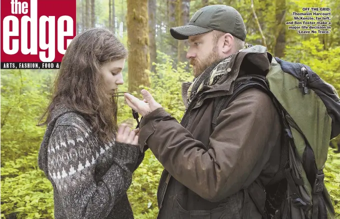  ??  ?? OFF THE GRID: Thomasin Harcourt McKenzie, far left, and Ben Foster make a major life decision in ‘Leave No Trace.’