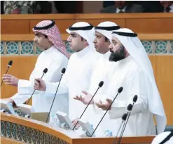  ??  ?? KUWAIT: Opposition MPs (from left) Riyadh Al-Adasani, Abdulkaree­m Al-Kandari, Al-Humaidi Al-Subaei and Waleed Al-Tabtabaei pray during a session at the National Assembly yesterday. —- Photo by Yasser Al-Zayyat