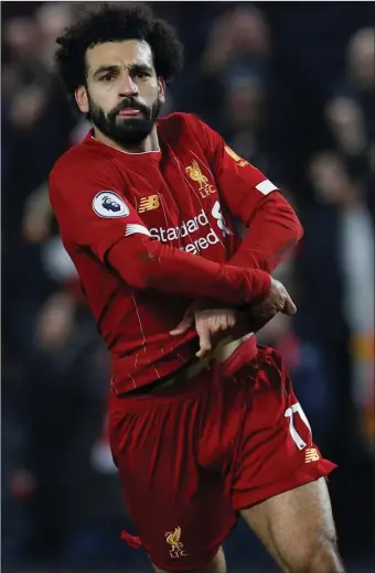  ??  ?? Liverpool’s Mo Salah celebrates after scoring against Manchester United on Sunday.