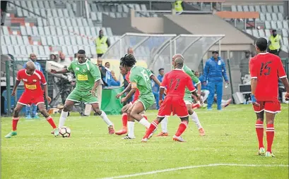  ?? Picture: RANDELL ROSKRUGE ?? CLOSE GAME: A Super Eagles player, in green, controls the ball during their ABC Motsepe final clash with Uthongathi played at Buffalo City Stadium yesterday