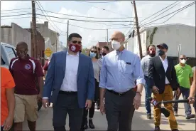  ?? RACHEL RAVINA - MEDIANEWS GROUP ?? Bridgeport Borough Manager Keith Truman, left, and Gov. Tom Wolf walk through the streets of Bridgeport Wednesday afternoon.