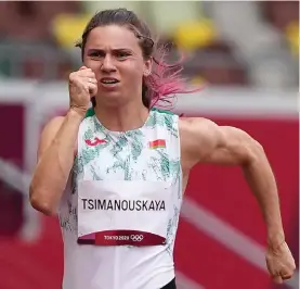  ?? ?? Krystsina Tsimanousk­aya, of Belarus, runs in the women's 100‑ meter run at the 2020 Summer Olympics in Tokyo, July 30, 2021.