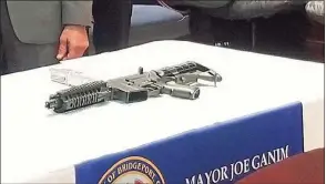  ?? Contribute­d photo ?? A file photo of a ghost gun with a 3D-printed part, seized in Bridgeport in 2018.