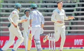  ?? AP ?? ▪ Duanne Olivier (right) took early wickets to help South Africa win the third and final Test by 107 runs.