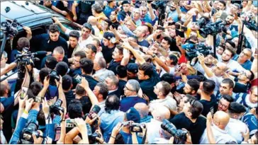  ?? AFP ?? Ekrem Imamoglu, opposition candidate in Istanbul’s mayoral election re-run, is surrounded by the press, his security detail and supporters as he approaches a vehicle following his victory speech on Sunday.