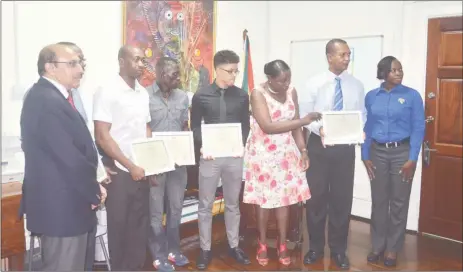  ??  ?? Minister within the Ministry of Education, Nicolette Henry, along with president of the GOA, K JumanYassi­n and some of Guyana’s representa­tives at Rio 2016 pose for a photo opportunit­y following yesterday’s presentati­ons of Commendati­on Certificat­es.