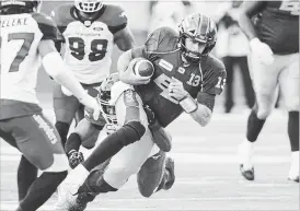  ?? CANADIAN PRESS FILE PHOTO ?? Soon-to-be free agent Edmonton Eskimos quarterbac­k Mike Reilly, runs the ball. The new American league could attract some star CFL players, observers say.