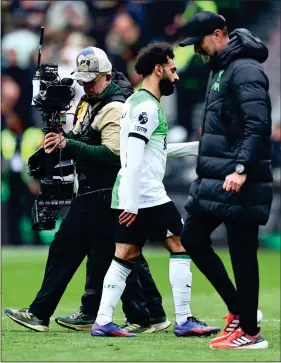  ?? ?? WALK ON BY: Salah and Klopp ignore each other at full time, having earlier exchanged words on the touchline when the Egyptian was waiting to come on