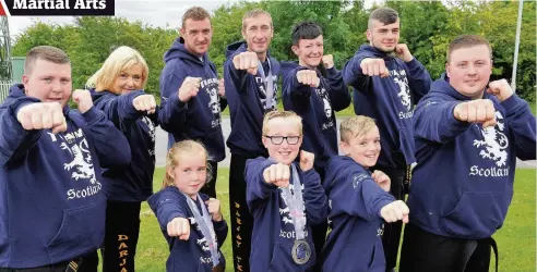  ??  ?? Team spirit (Back, left to right): Daryn Duncan, Hayley Duncan, Andy Hughes, Stuart Gaughan, Jennifer Boyle, Ross Kerr and Jayson Duncan and (front): Hollie Gaughan, Mark Gaughan and Robbie Hughes did well at the World Championsh­ips in Birmingham