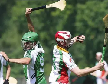  ??  ?? Avondale’s Dean Gahan is beaten to the ball by Kiltegan’s Seanie Germaine during the SHC in Pearse’s Park.