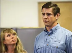  ?? AP PHOTO ?? Patrick Hale, the man credited by law enforcemen­t with forcing the surrender of two Georgia prison escapees, speaks to reporters Friday in Murfreesbo­ro, Tenn., while his wife, Danielle, looks on.