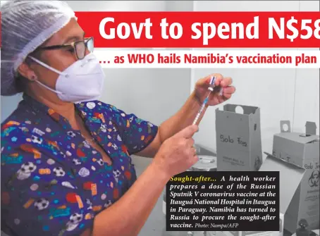  ?? Photo: Nampa/AFP ?? Sought-after… A health worker prepares a dose of the Russian Sputnik V coronaviru­s vaccine at the Itauguá National Hospital in Itaugua in Paraguay. Namibia has turned to Russia to procure the sought-after vaccine.