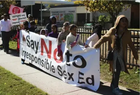  ?? TORONTO STAR FILE PHOTO ?? About 200 parents and children protest over the provincial government’s new sex-education curriculum outside Thorncliff Park school last October.