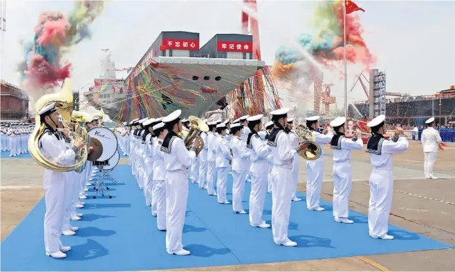  ?? ?? ‘New ship is comparable in size to the US navy’s aircraft carriers and could be a game changer for the Chinese navy’
The ship was launched in Shanghai amid huge pomp and ceremony