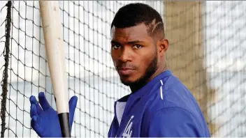  ?? THE ASSOCIATED PRESS FILES ?? Yasiel Puig is one of four players being sent from the Los Angeles Dodgers to the Cincinnati Reds. The Dodgers get back struggling MLB pitcher Homer Bailey and a couple of prospects.