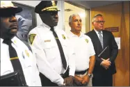  ?? Ned Gerard / Hearst Connecticu­t Media ?? Jim Carroll, far right, deputy director of the White House Office of National Drug Control Policy, stands with, from left, New Haven Fire Chief John Alston, New Haven Police Chief Anthony Campbell and New Haven Director of Emergency Operation Rick Fontana during a news conference following a meeting with state and city officials at the Connecticu­t Mental Health Center in New Haven on Monday.