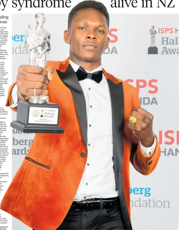  ?? Photo / Photosport ?? Israel Adesanya with his Sportsman of the Year Award.