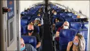  ?? CHRISTOPHE­R REYNOLDS/ LOS ANGELES TIMES ?? Passengers fill a Southwest Airlines flight in Junewith middle seats left open. CEOGary Kellywrote that “we will resume selling all available seats for travel beginning December 1.”