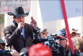  ?? Morgan Lee / Associated Press ?? Otero County Commission­er Couy Griffin speaks in Santa Fe, N.M., during a gun rights rally. Griffin, who founded the group “Cowboys for Trump,” entered the Capitol grounds in Washington on Jan. 6, then kept posting on Parler about his support for continuing the fight and told his fellow county commission­ers that he planned to attend the inaugurati­on armed.