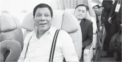  ?? (Presidenti­al photo) ?? PRESIDENT Duterte is all smiles as he heads back home after a successful participat­ion in the AsiaPacifi­c Economic Cooperatio­n Summit in Vietnam. He was accompanie­d by, among others, Special Assistant to the President Christophe­r Lawrence Go.