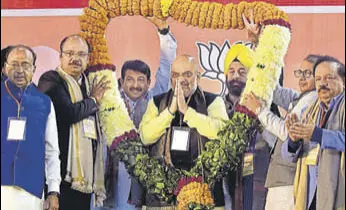  ?? SUSHIL KUMAR/HT PHOTO ?? BJP national president Amit Shah after addressing his party’s booth level in-charges at the Indira Gandhi Indoor Stadium in New Delhi on Sunday.