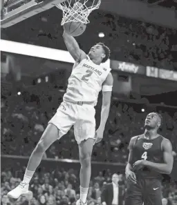  ?? JULIO CORTEZ/AP ?? Maryland guard Aaron Wiggins dunks against Oakland on Saturday in College Park, Md.