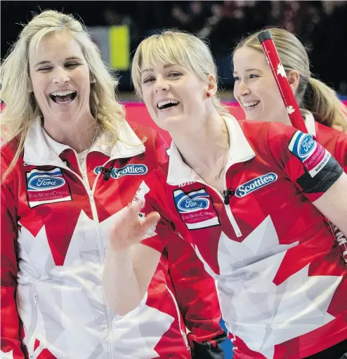  ?? PAUL CHIASSON / THE CANADIAN PRESS ?? From left, skip Jennifer Jones, lead Dawn McEwen and third Kaitlyn Lawes of Team Canada are all smiles after beating China 9-5 Monday to improve to 4- 0 at the world women’s curling championsh­ip ongoing in North Bay.